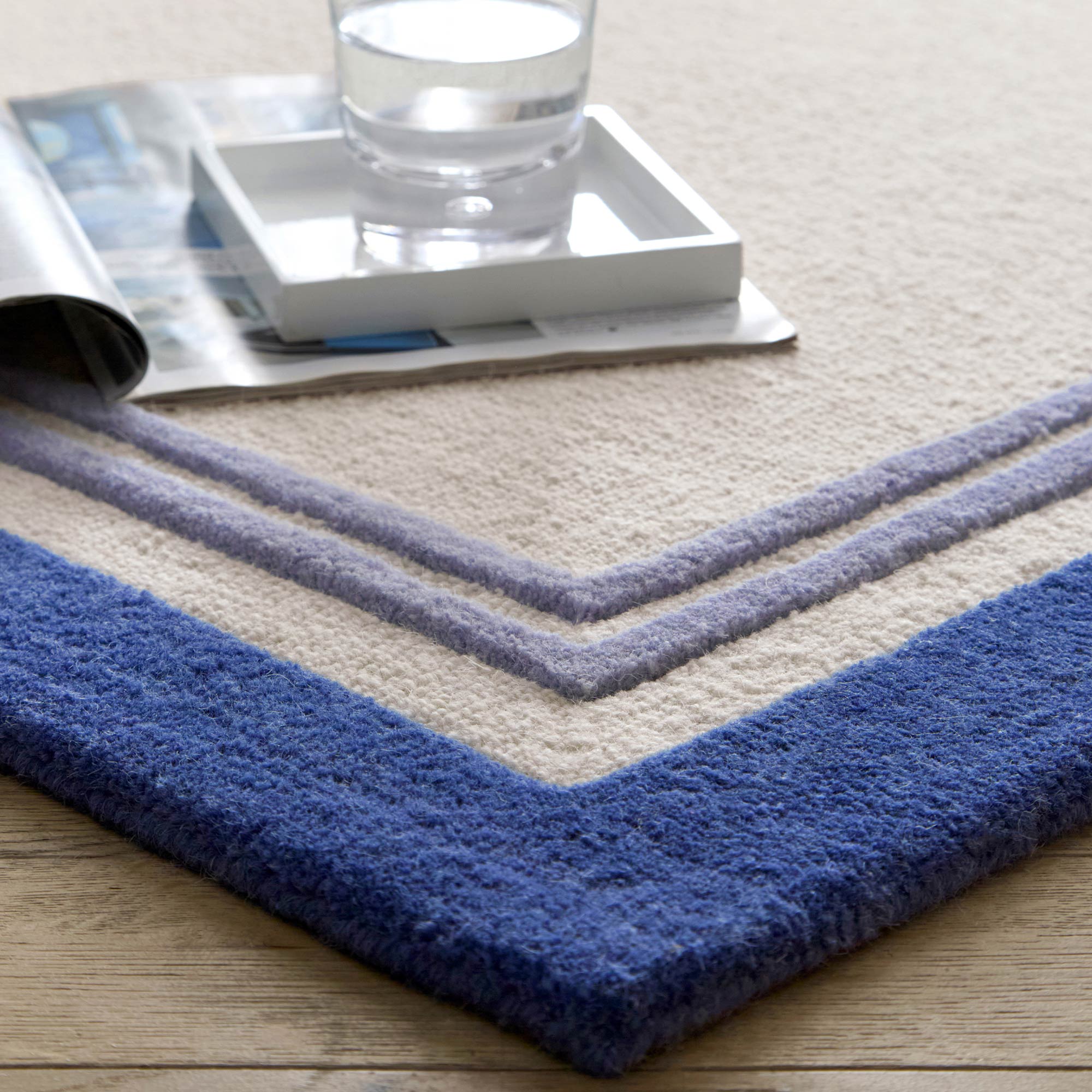 100% Wool Rug in Cream with Blue Boarder