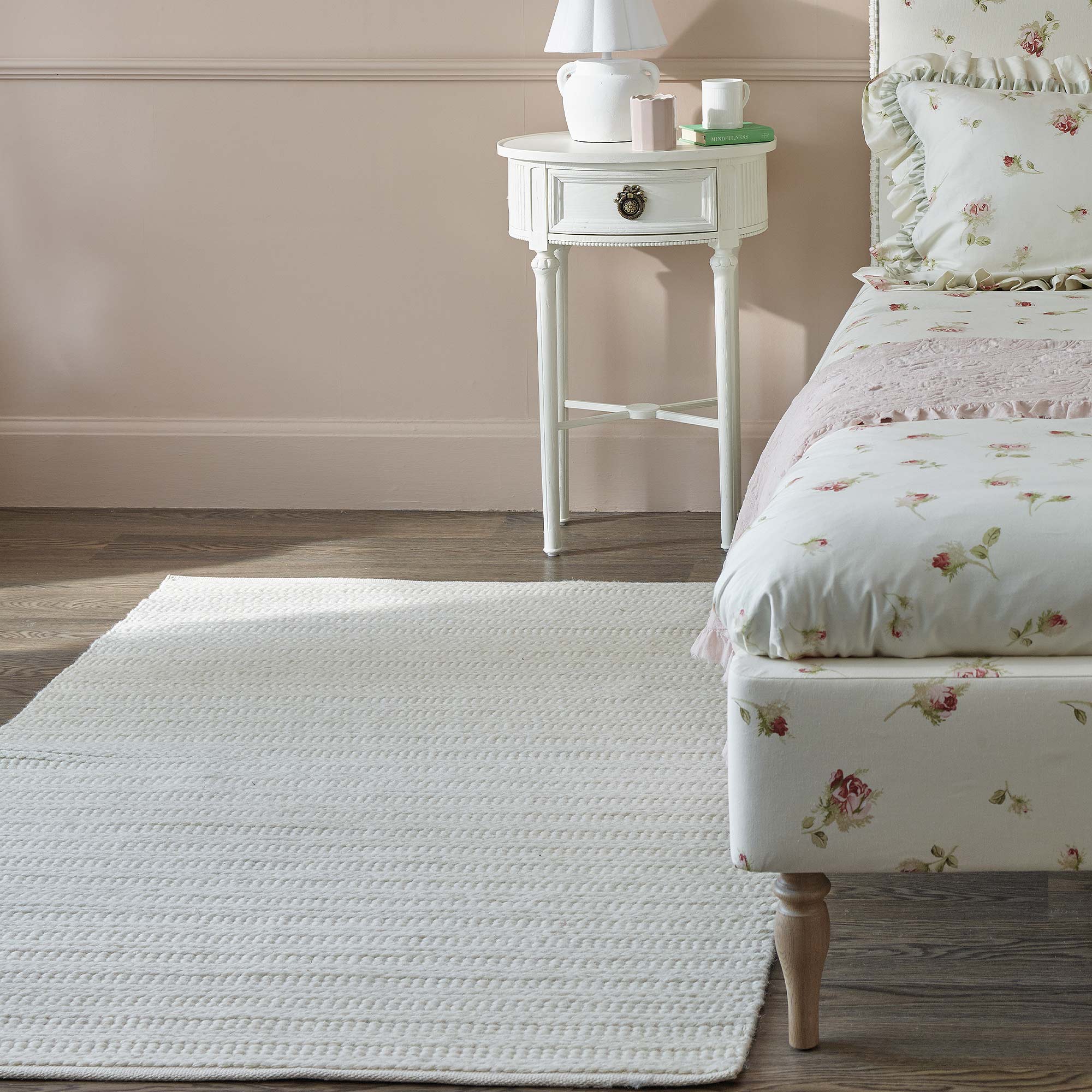 Crisp White Wool Rug in Pink and Floral Bedroom