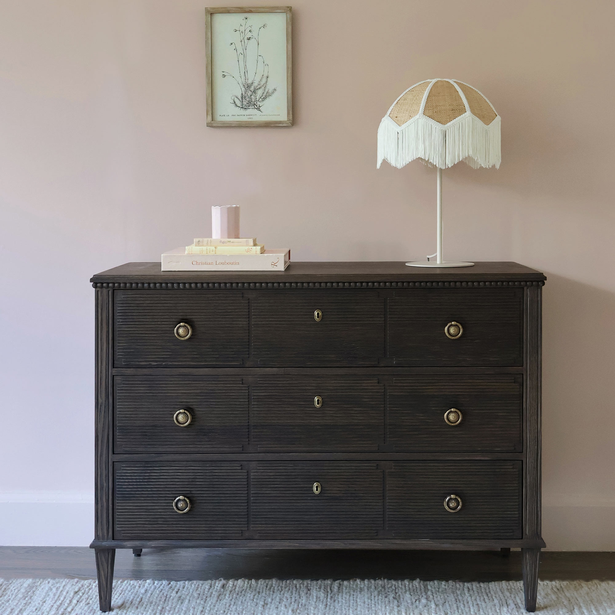 Dark Wood Drawers With Fringed Lamp 