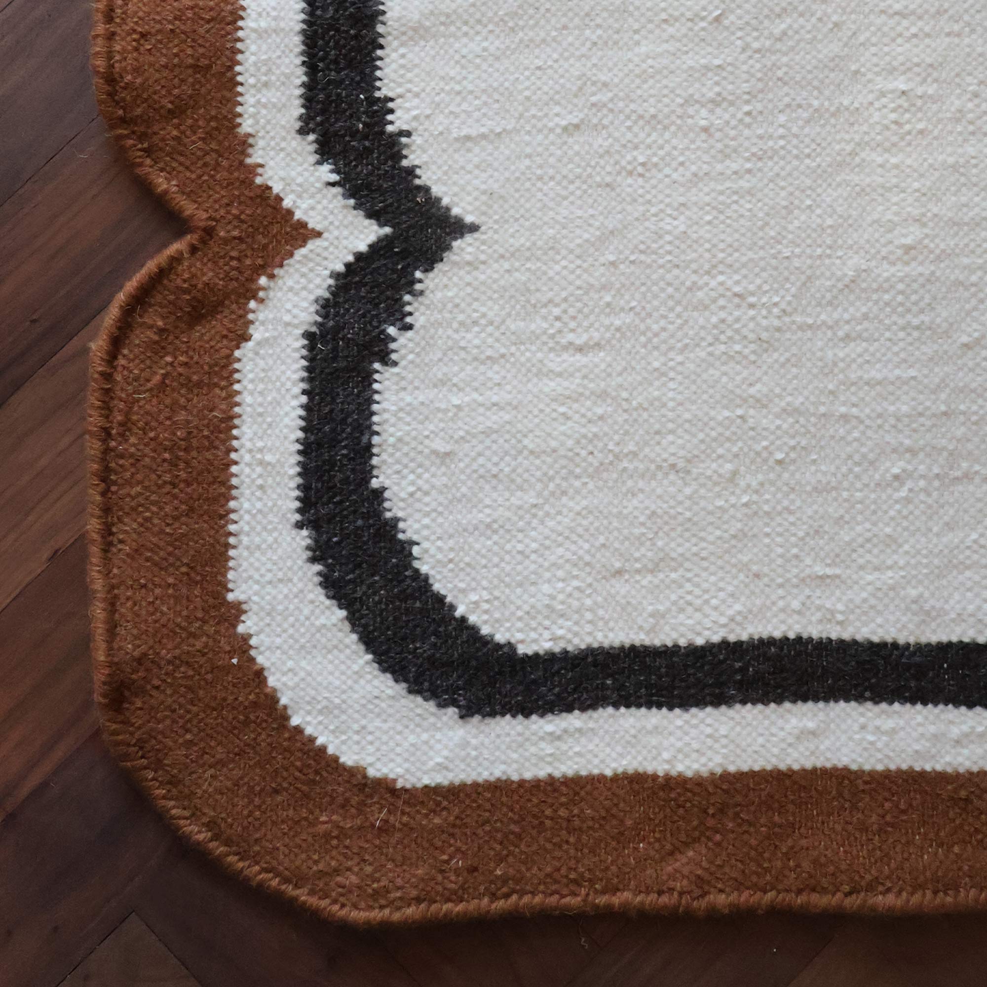 Close Up Detail of Brown, White and Black Wiggle Rug