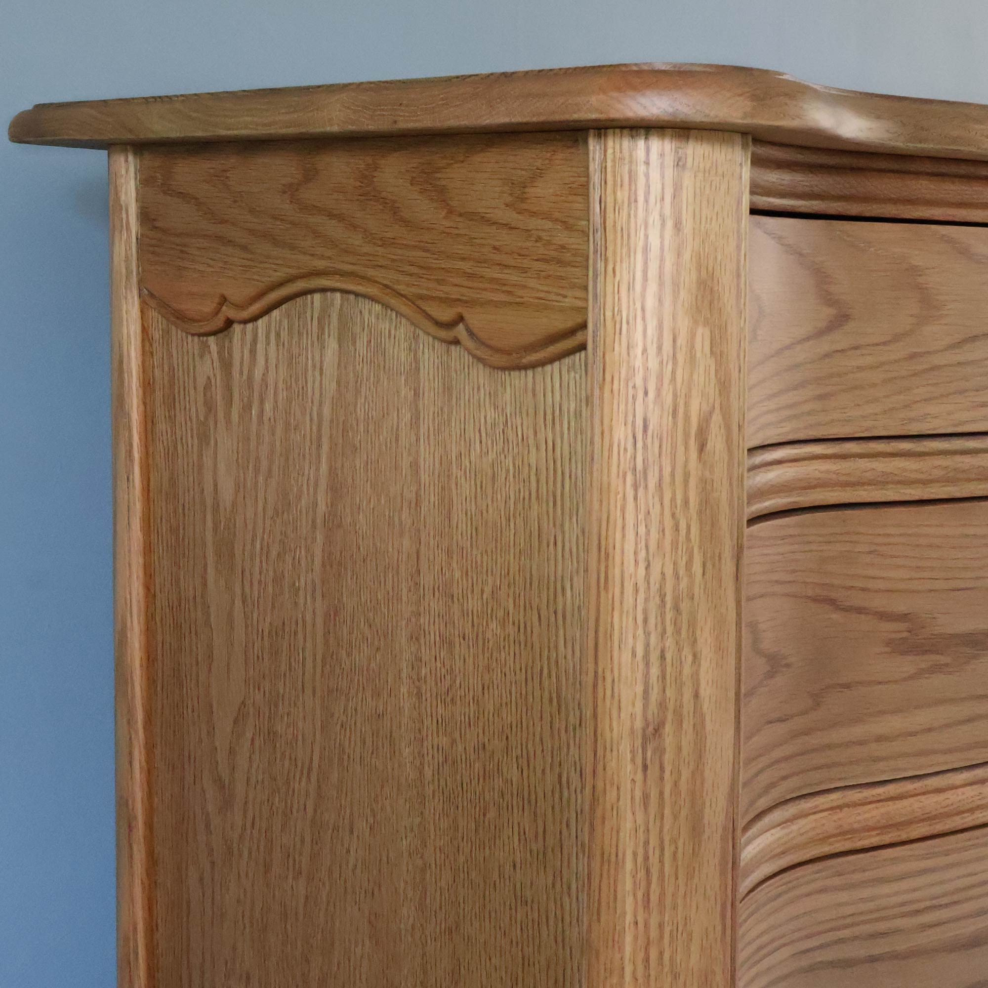 Solid Oak Tall Chest With Sweeping Curves And Delicate Side Detailing