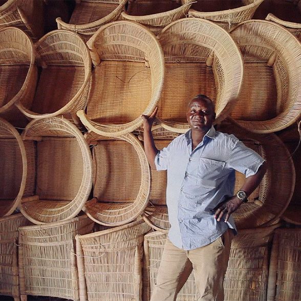 an artisan with their finished rattan products